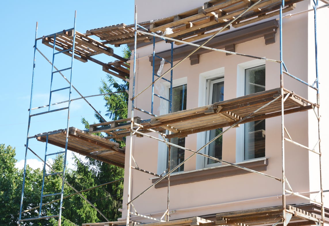 Painting and Plastering Exterior House Scaffolding Facade Wall.